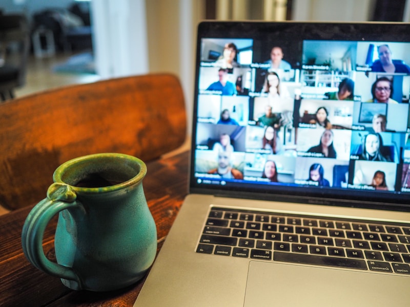 Remote team meeting displayed on a laptop